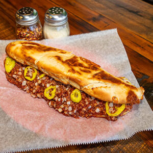 The Sloppy Joe Sandwich, Crumbled Sausage with Our Special Sauce, Banana Pepper Rings & Onions