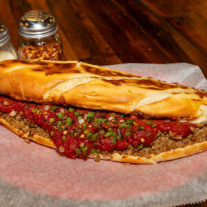 Wicked Stromboli, Crumbled Sausage, Wicked (Secret) Sauce, Cheese, Green Peppers, Onions This one has a Kick!